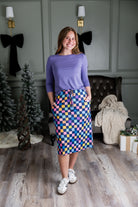 Model wearing Nuggles® 27 inch Sport Flex Skirt with pockets and drawstring waistband