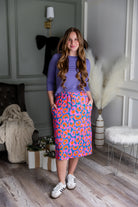 Model wearing Nuggles® 27 inch Sport Flex Skirt with pockets and drawstring waistband