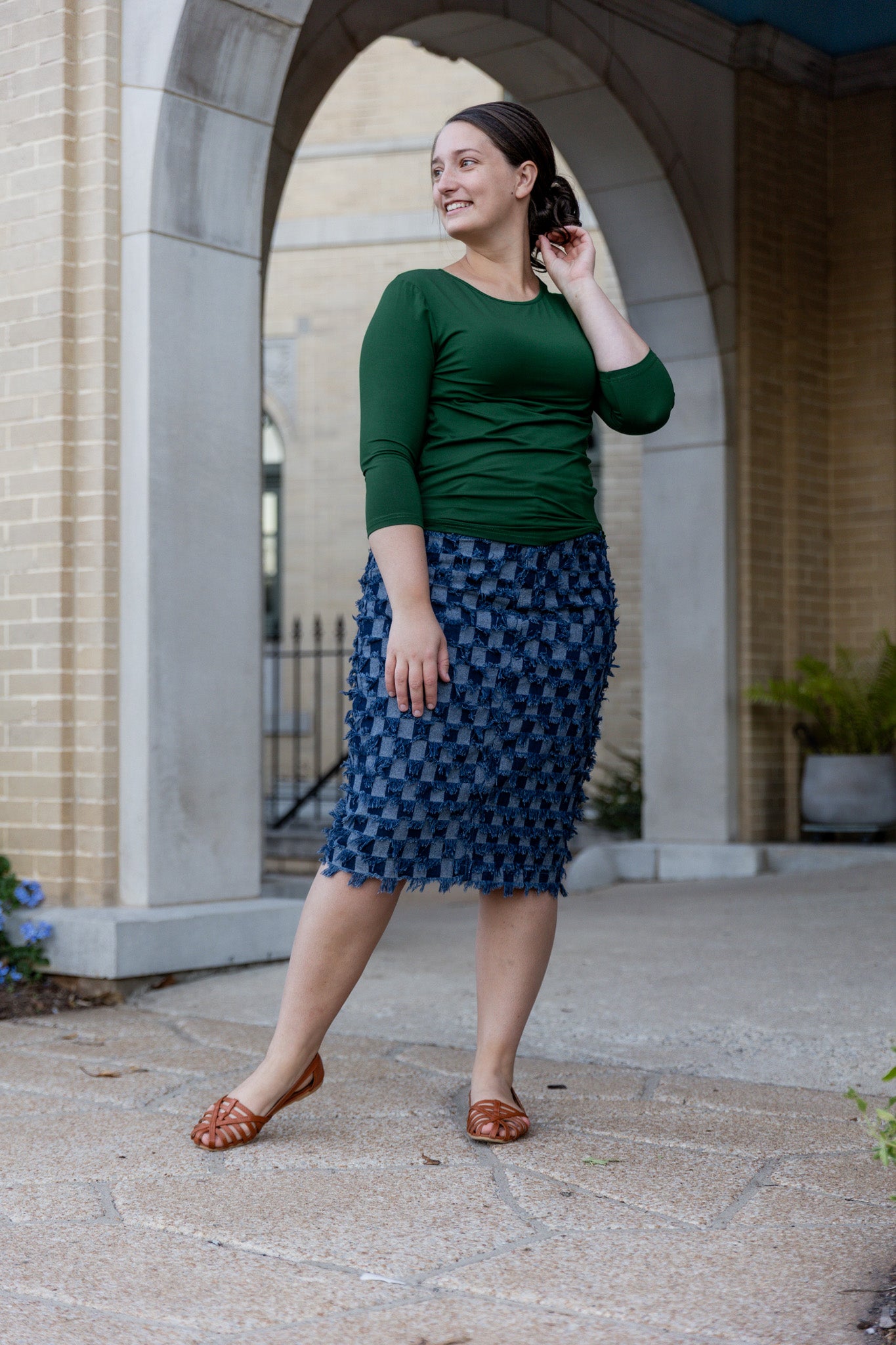 Nuggles® denim midi skirt with soft stretch fabric, wide elastic waistband, modest length, and functional pockets. Available in 27", 31", and 34" lengths.