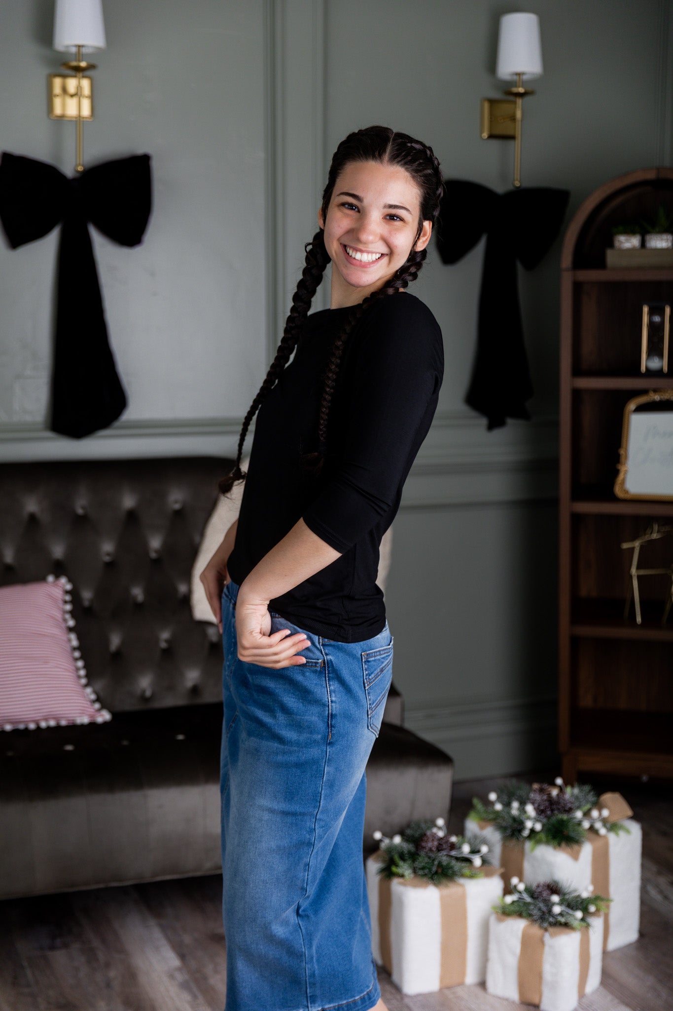 Nuggles® denim midi skirt with soft stretch fabric, wide elastic waistband, modest length, and functional pockets. Available in 27", 31", and 34" lengths.