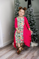 Nuggles® Raegan girls’ dress demonstrated on young model for product listing.