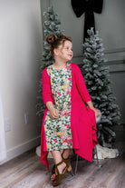 Nuggles® Raegan girls’ dress demonstrated on young model for product listing.