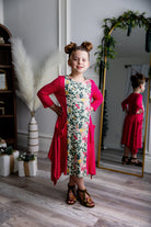 Nuggles® Raegan girls’ dress demonstrated on young model for product listing.