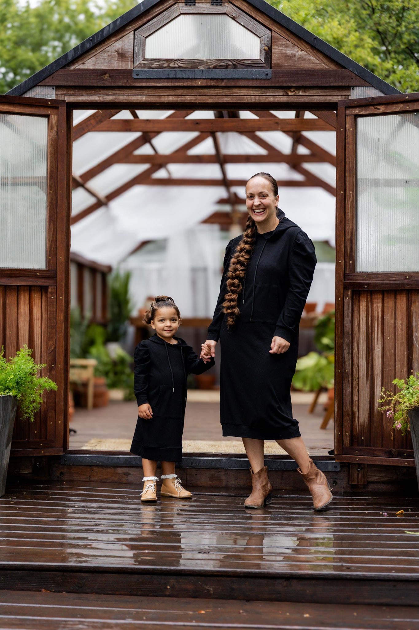 Model wearing Nuggles® Zoelle Dress in solid color, modest hoodie dress with puff sleeves.