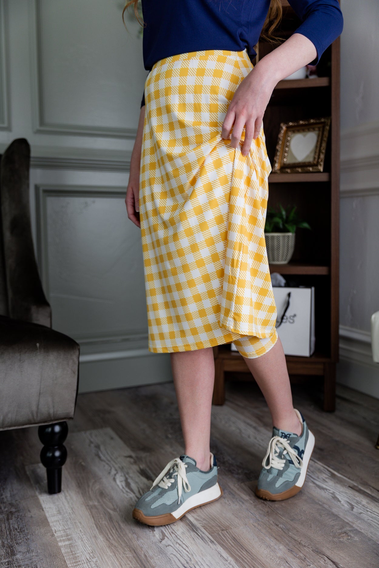 Model wearing Nuggles® 27" Sport Skirt in  Sunshine Check