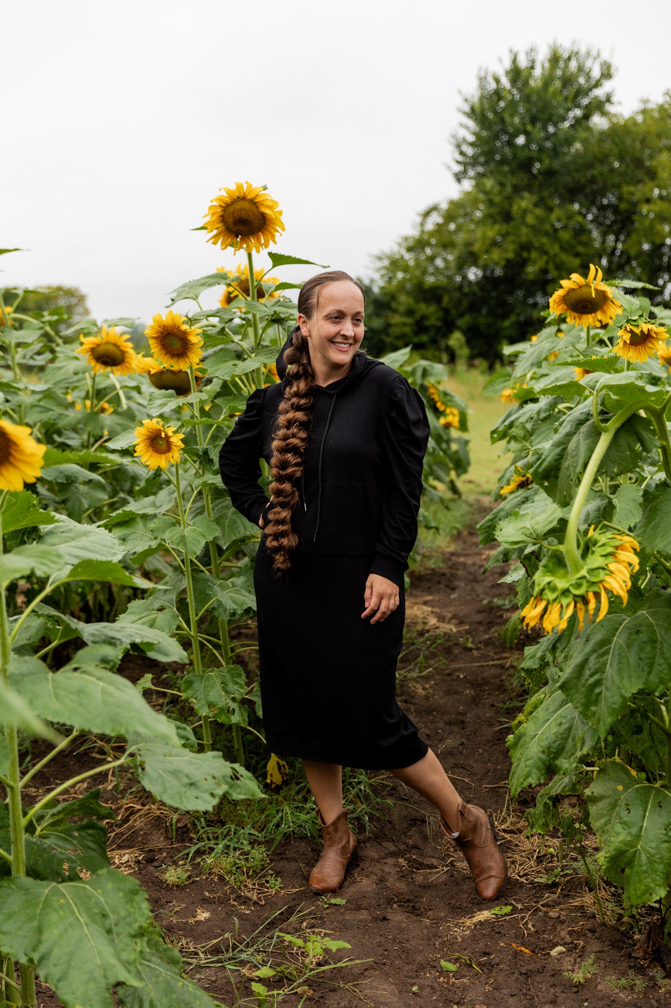 Model wearing Nuggles® Zoelle Dress in solid color, modest hoodie dress with puff sleeves.