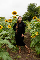 Model wearing Nuggles® Zoelle Dress in solid color, modest hoodie dress with puff sleeves.