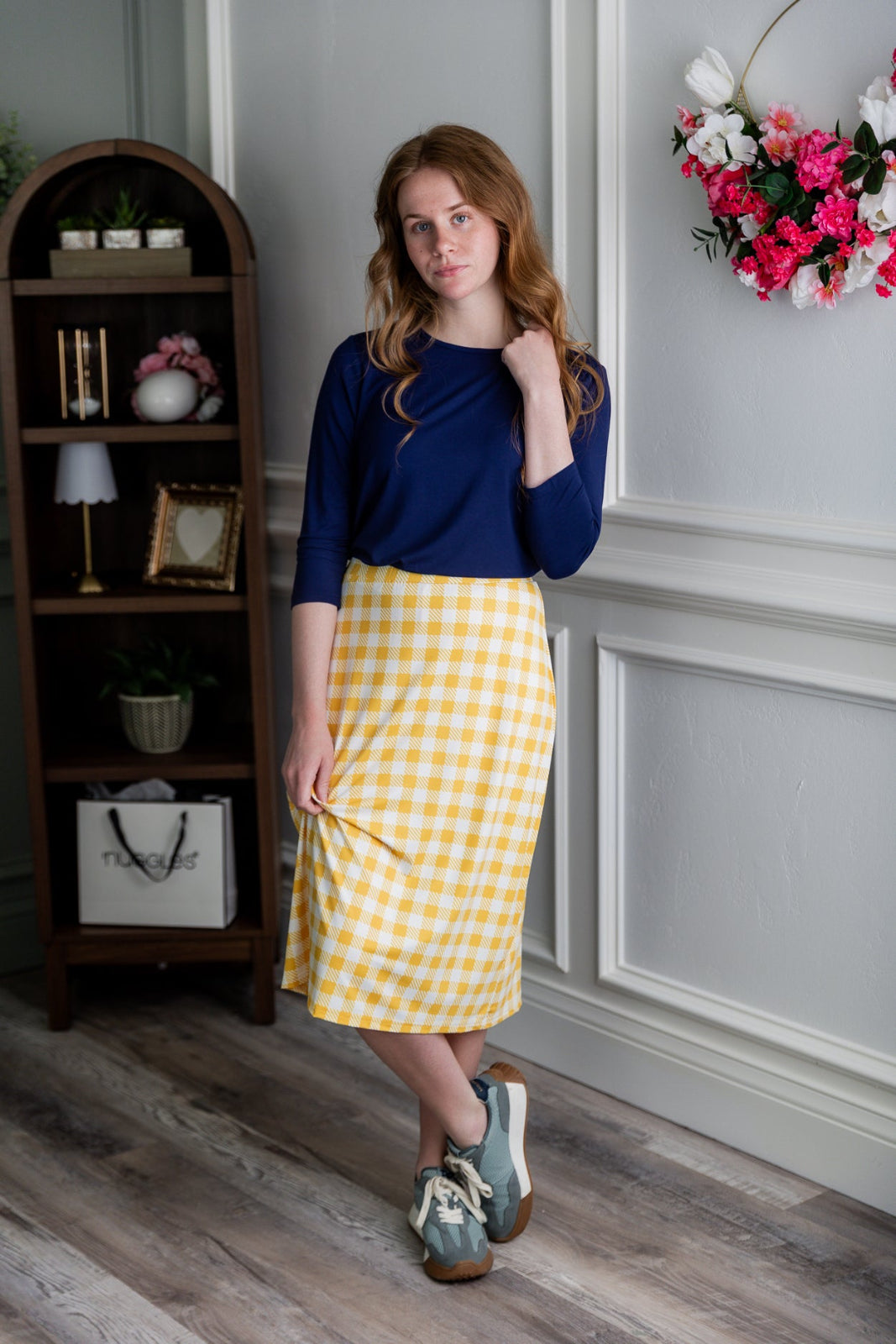Model wearing the Nuggles®  27" All-Sport Skirt in Sunshine Check