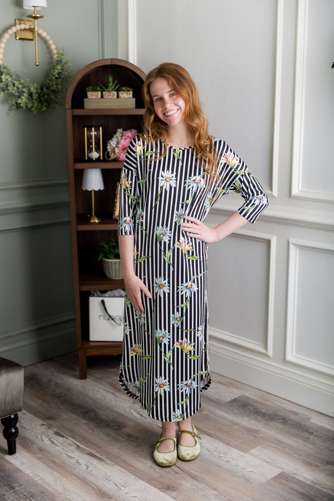 Model wearing the Nuggles® Heather Dress in Daisy Stripe
