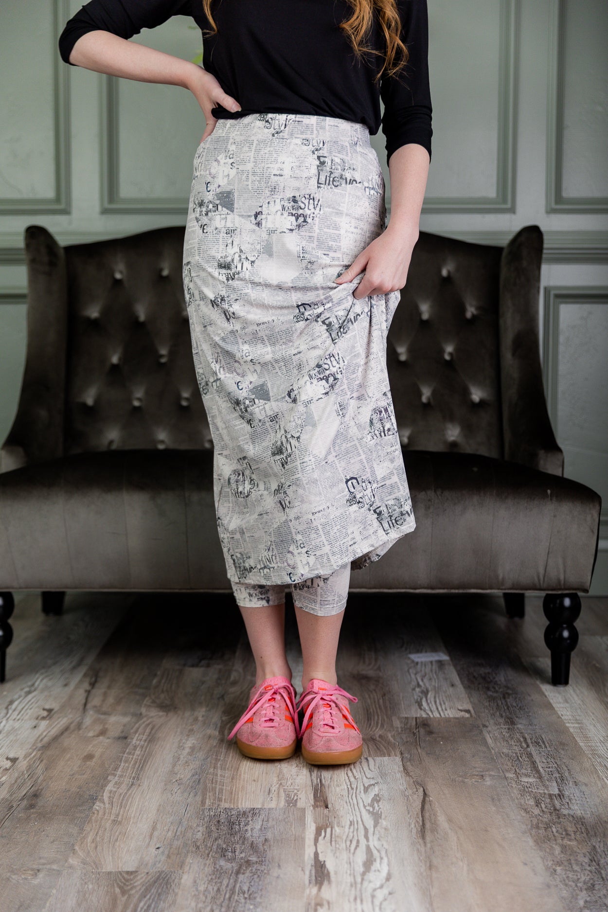 Model wearing Nuggles® 31" Sport Skirt in  Whispering Headlines