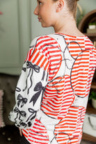 Model wearing the Nuggles® Bryauna Top in Boardwalk Bows