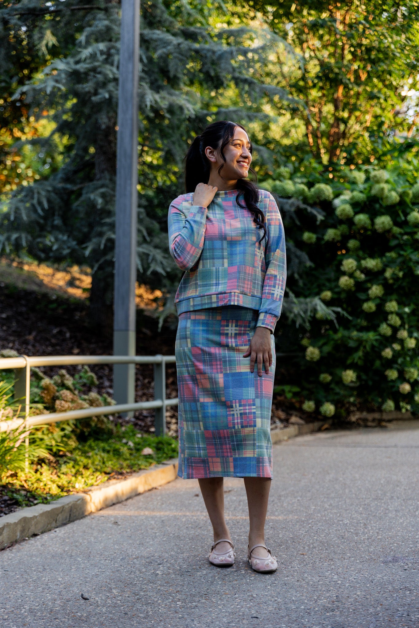 Nuggles® Iris two-piece set featuring soft knit midi skirt and crew-neck sweatshirt top