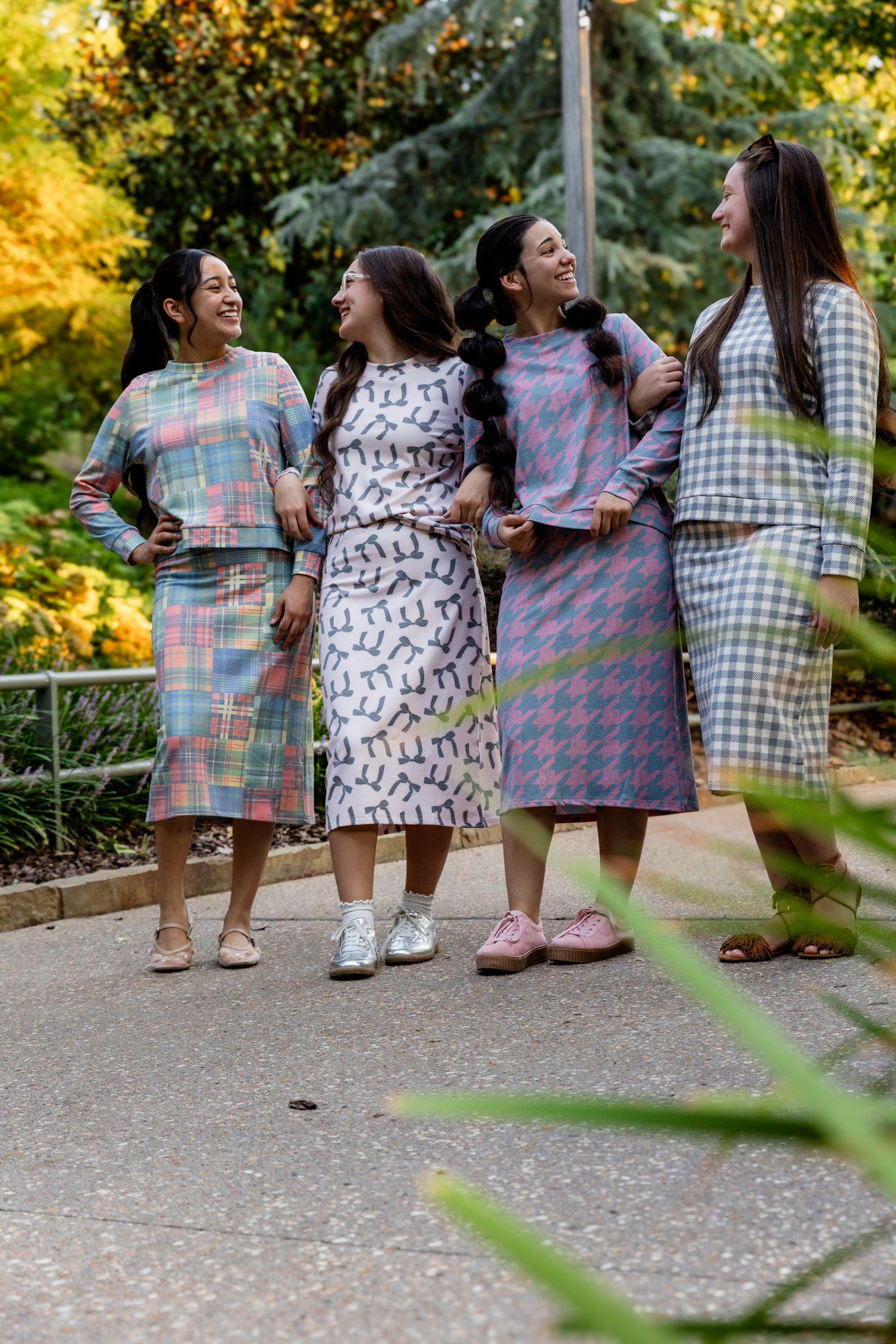 Nuggles® Iris two-piece set featuring soft knit midi skirt and crew-neck sweatshirt top