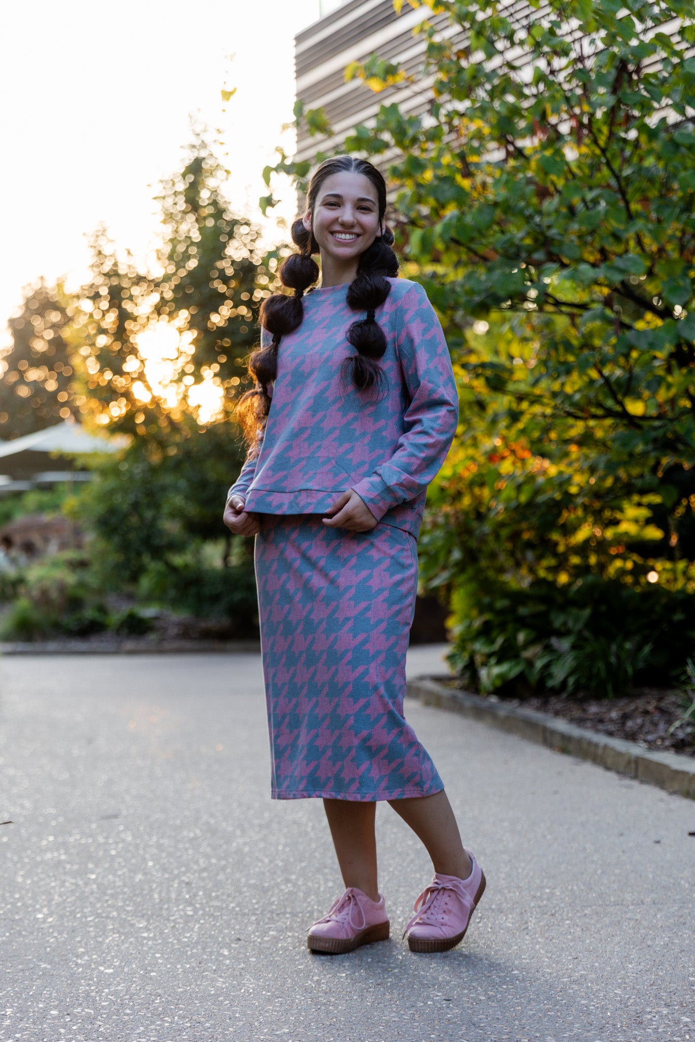 Nuggles® Iris two-piece set featuring soft knit midi skirt and crew-neck sweatshirt top