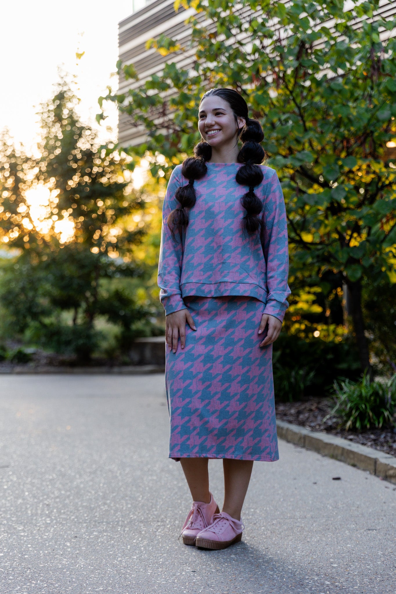 Nuggles® Iris two-piece set featuring soft knit midi skirt and crew-neck sweatshirt top