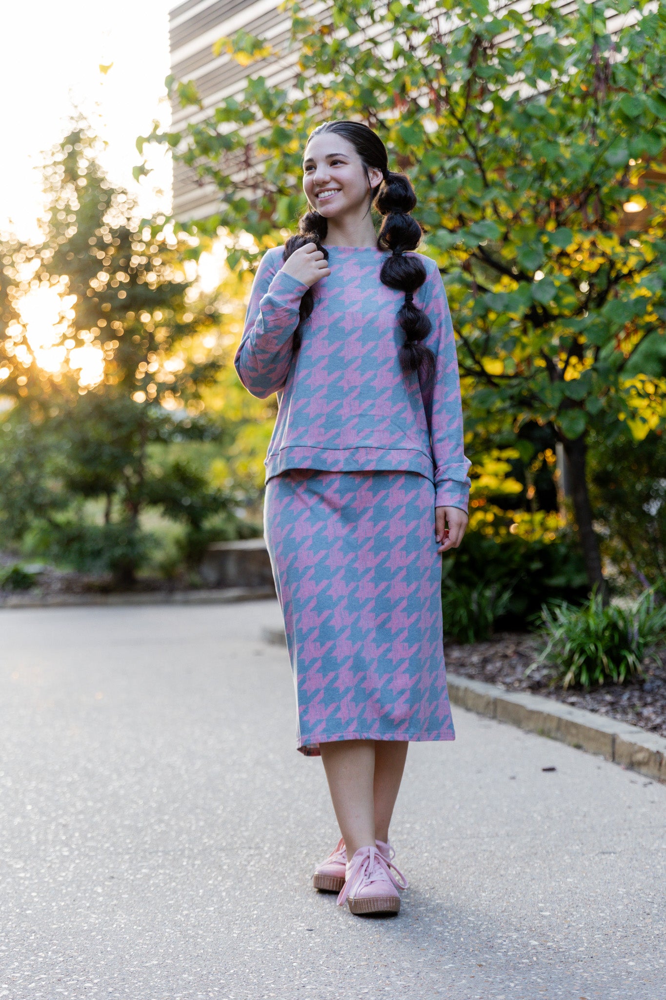 Nuggles® Iris two-piece set featuring soft knit midi skirt and crew-neck sweatshirt top