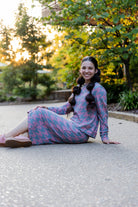 Nuggles® Iris two-piece set featuring soft knit midi skirt and crew-neck sweatshirt top