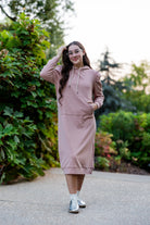 Model wearing Nuggles® Zoelle Dress in solid color, modest hoodie dress with puff sleeves.
