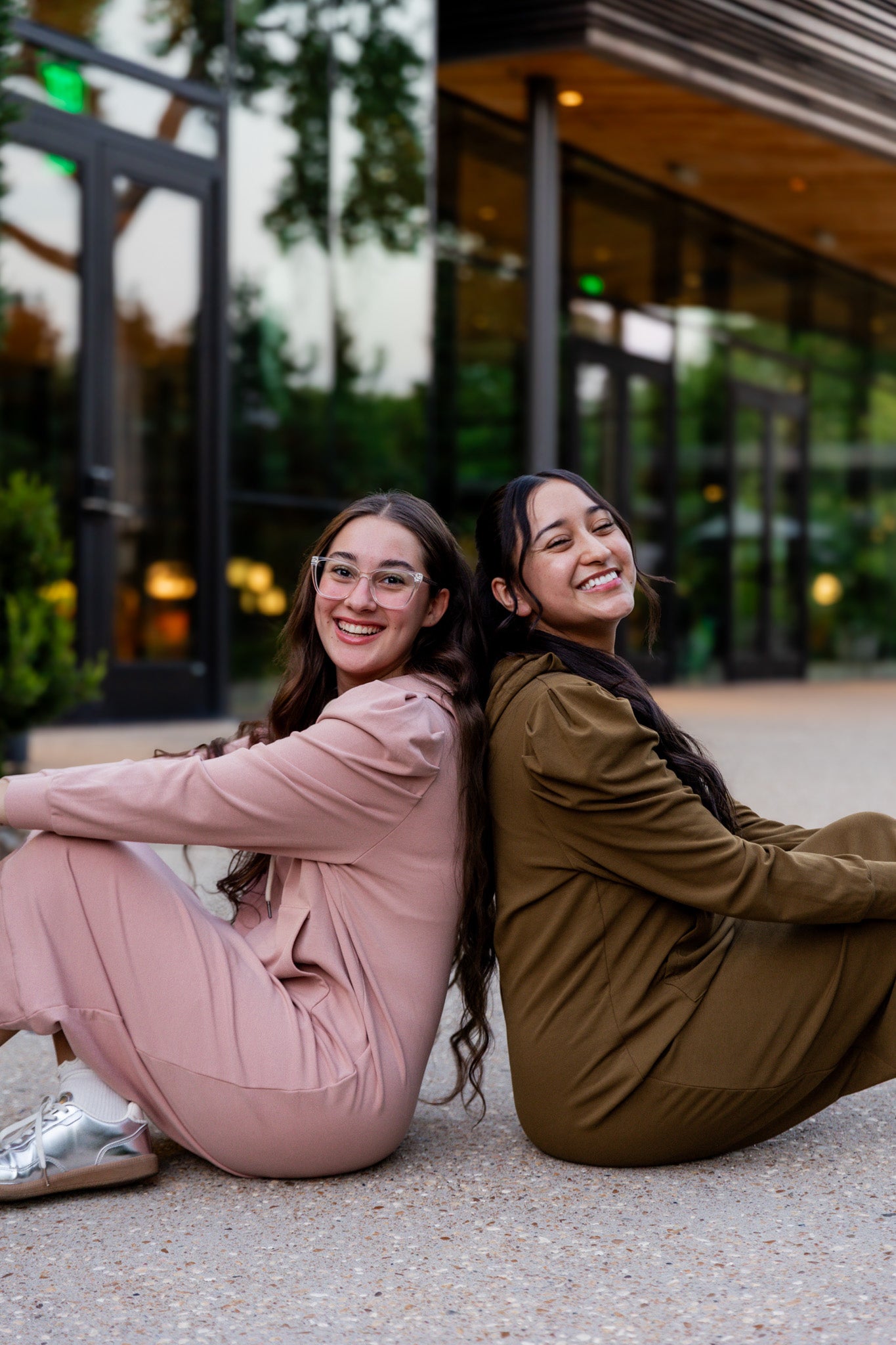 Model wearing Nuggles® Zoelle Dress in solid color, modest hoodie dress with puff sleeves.