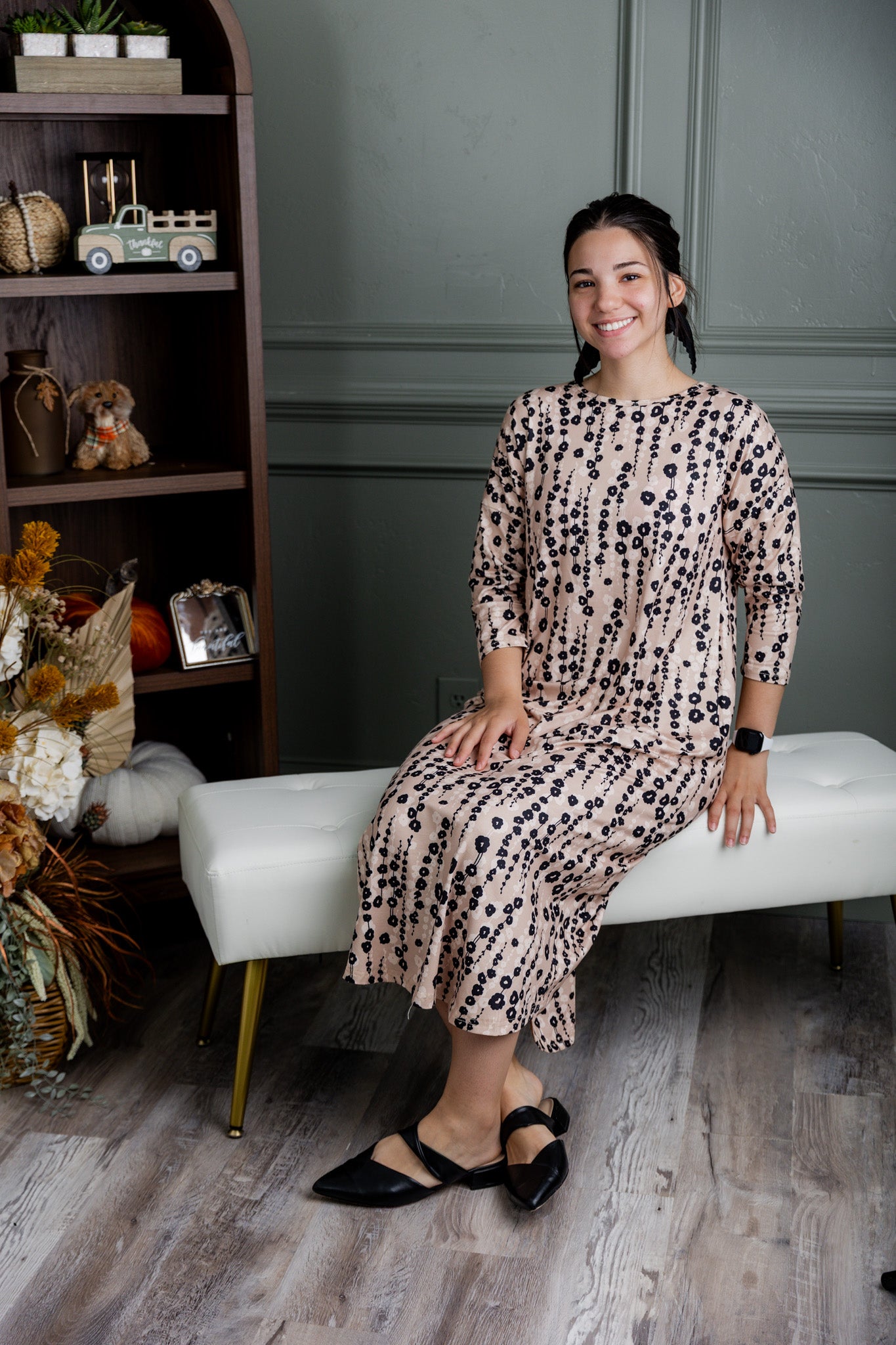 Model wearing Nuggles® Kate Dress in printed fabric, modest midi length with three-quarter sleeves.