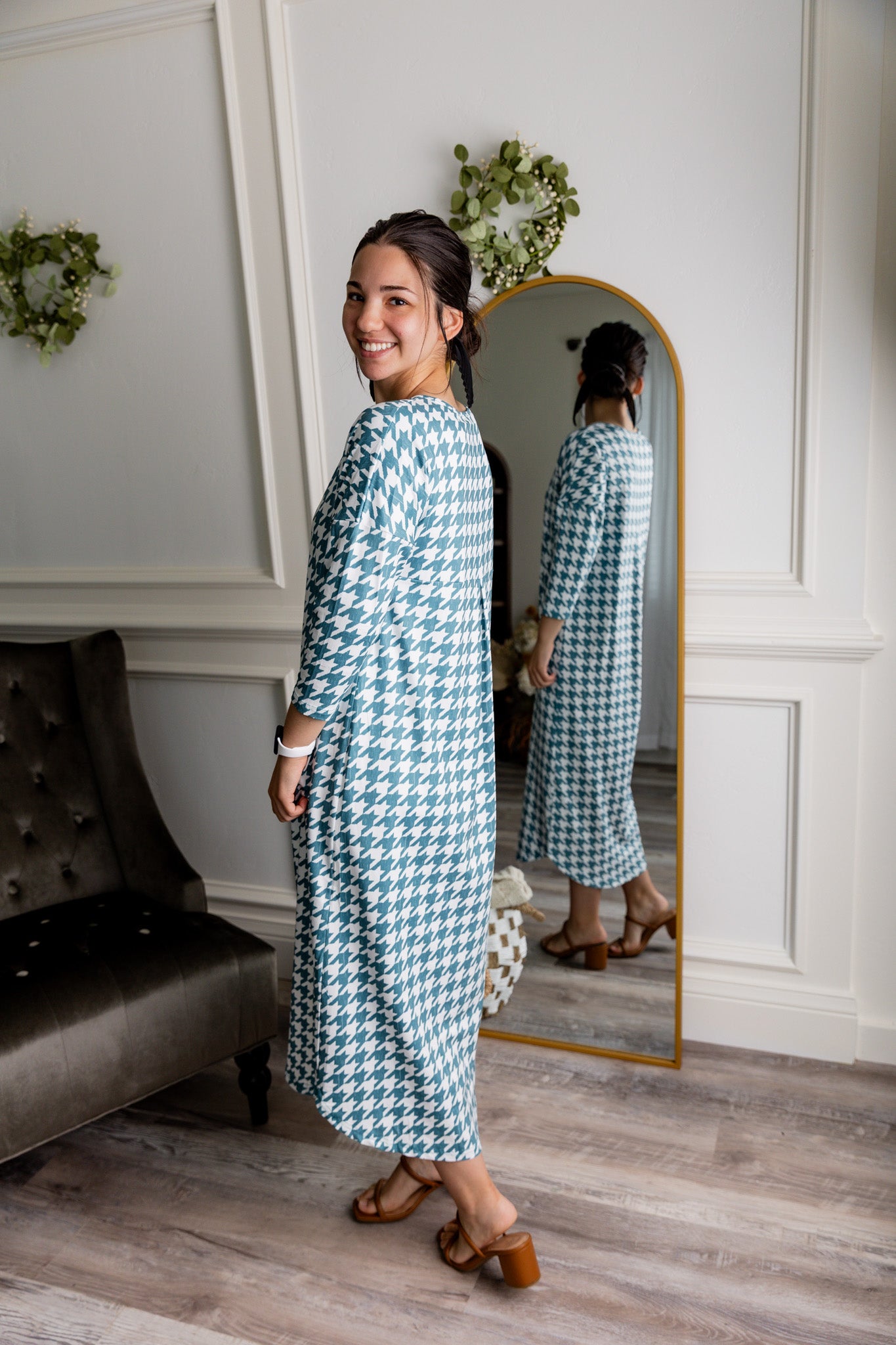 Model wearing Nuggles® Kate Dress in printed fabric, modest midi length with three-quarter sleeves.