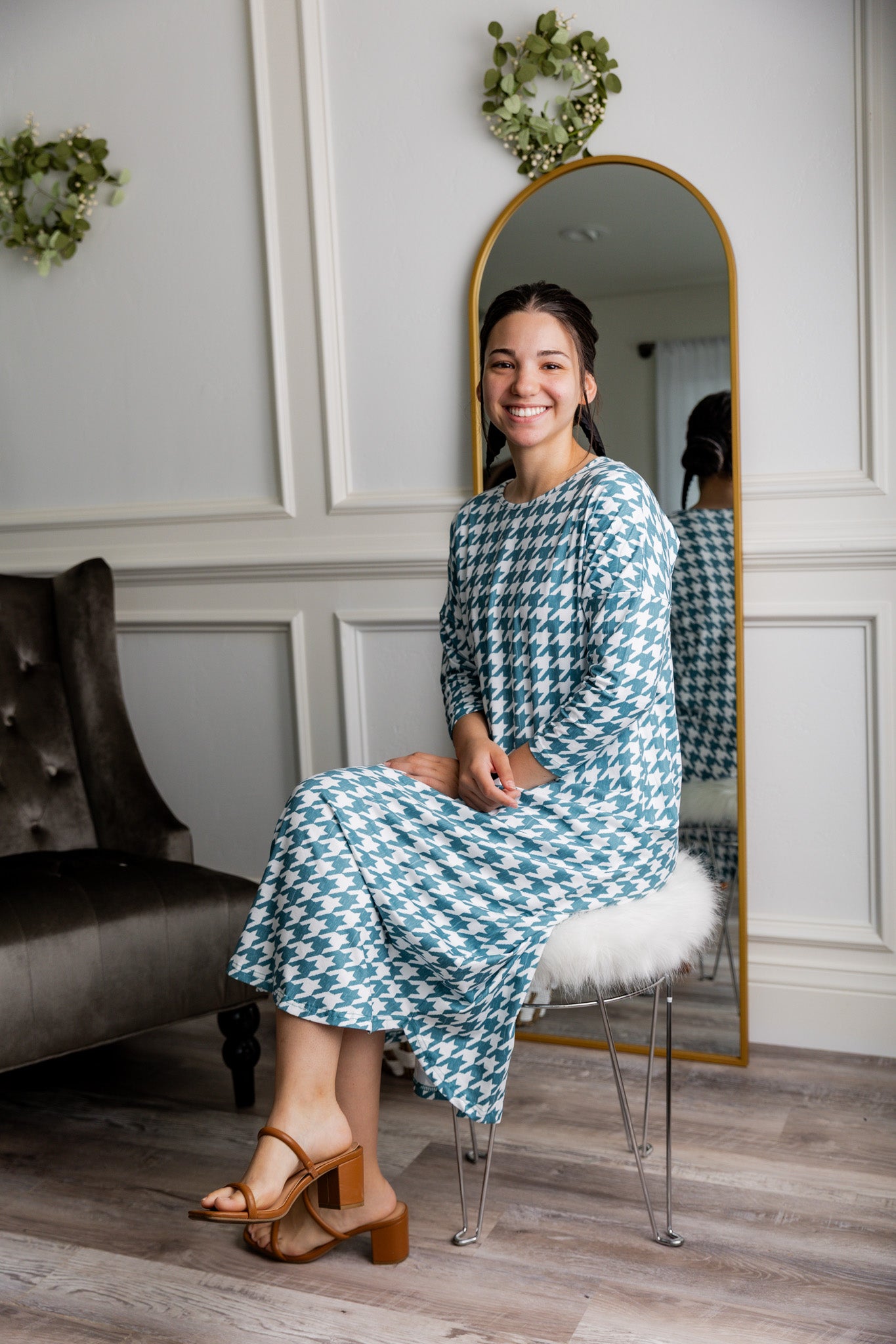 Model wearing Nuggles® Kate Dress in printed fabric, modest midi length with three-quarter sleeves.