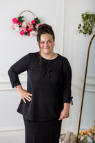 Nuggles® Lexi Top in waffle knit with 3/4 sleeves, bow detail, and modest A-line fit for women
