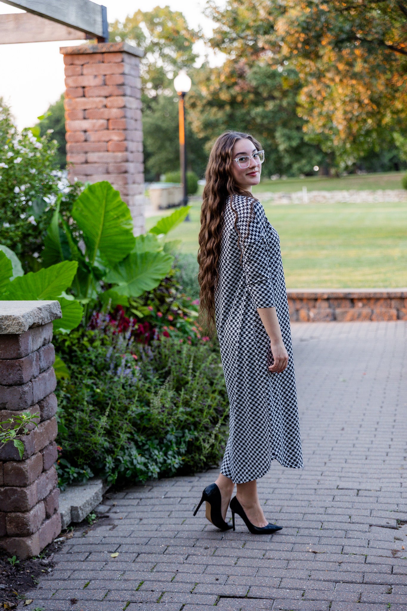 Model wearing Nuggles® Kate Dress in printed fabric, modest midi length with three-quarter sleeves.