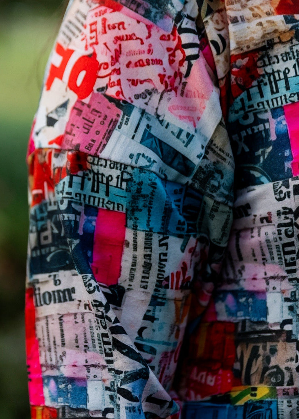 Model wearing Nuggles® Kate Dress in printed fabric, modest midi length with three-quarter sleeves.