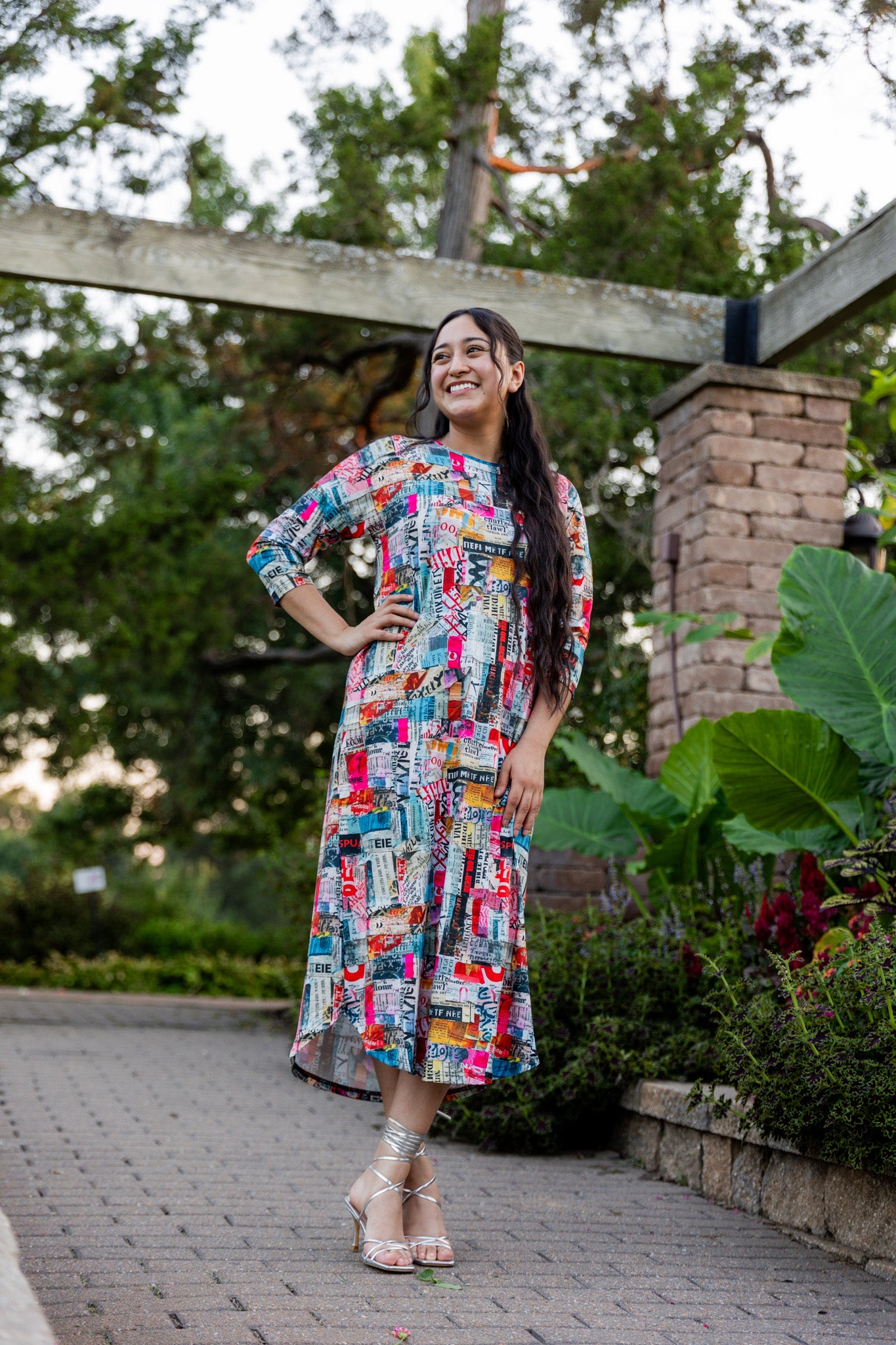 Model wearing Nuggles® Kate Dress in printed fabric, modest midi length with three-quarter sleeves.