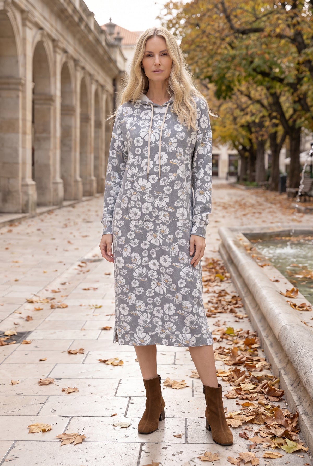 Nuggles® Hoodie Dress in Daisy Moon, full length with the hood down, white daisies on black
