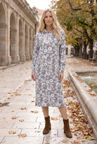 Nuggles® Hoodie Dress in Daisy Moon, full length with the hood down, white daisies on black