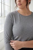 Model wearing Nuggles® 3/4 Essential Tee in Dark Heather