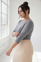 Model wearing Nuggles® 3/4 Essential Tee in Dark Heather