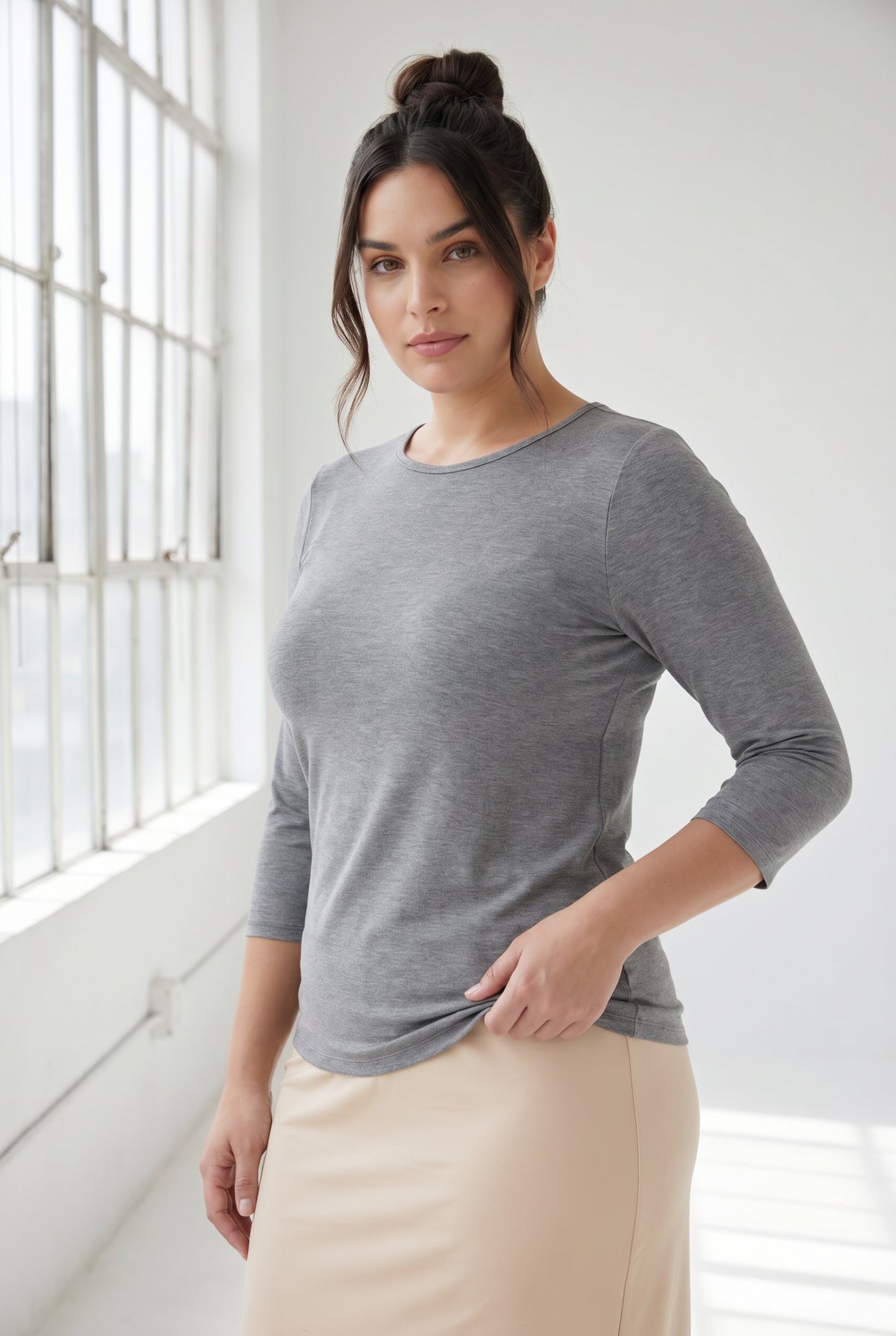 Model wearing Nuggles® 3/4 Essential Tee in Dark Heather