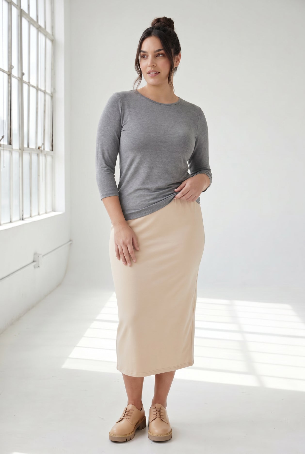 Model wearing Nuggles® 3/4 Essential Tee in Dark Heather
