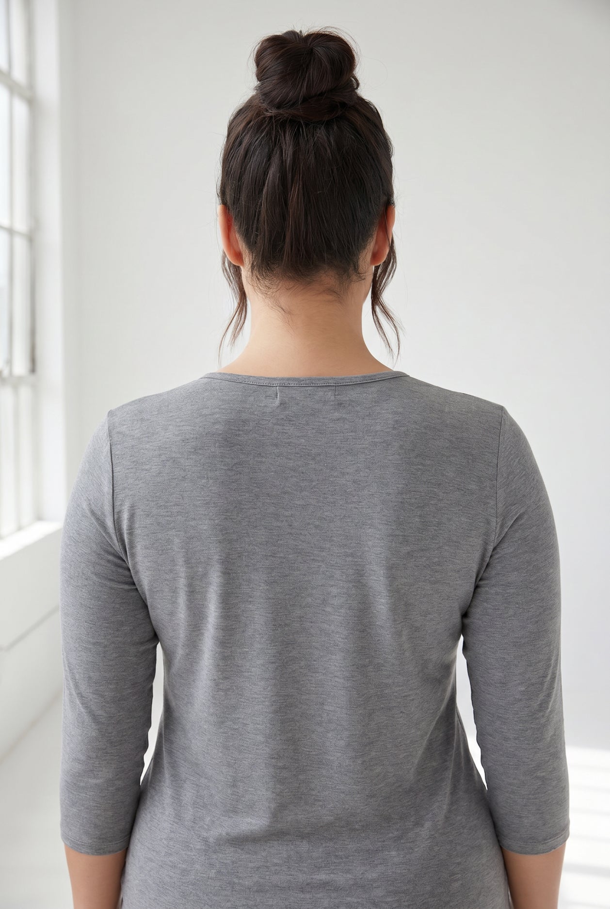 Model wearing Nuggles® 3/4 Essential Tee in Dark Heather