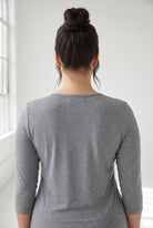 Model wearing Nuggles® 3/4 Essential Tee in Dark Heather