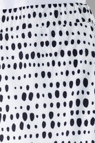 Model wearing Nuggles® 31" All-Sport Skirt in Dash Print