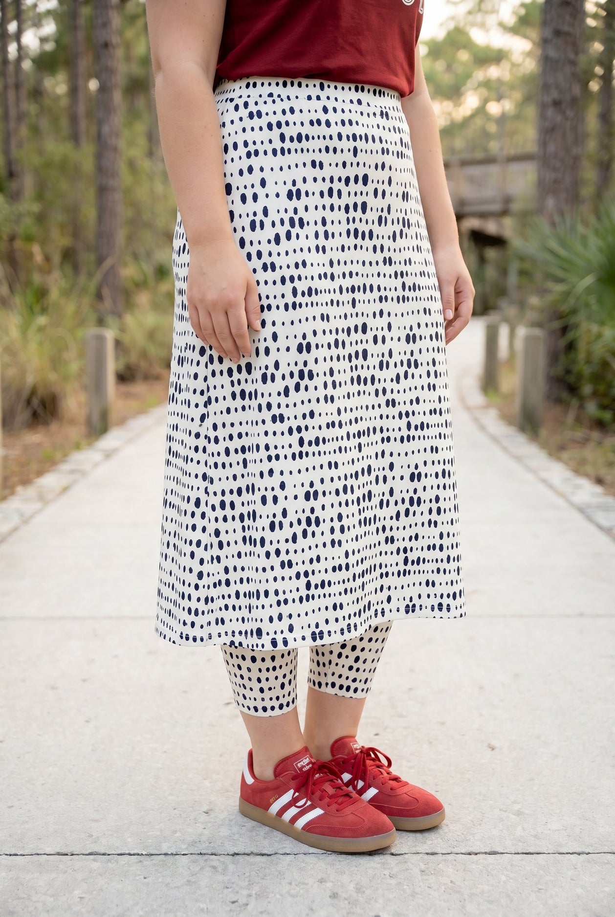 Model wearing Nuggles® 31" All-Sport Skirt in Dash Print