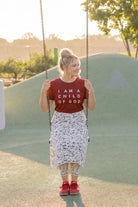 Model wearing Nuggles® 31" All-Sport Skirt in Dash Print