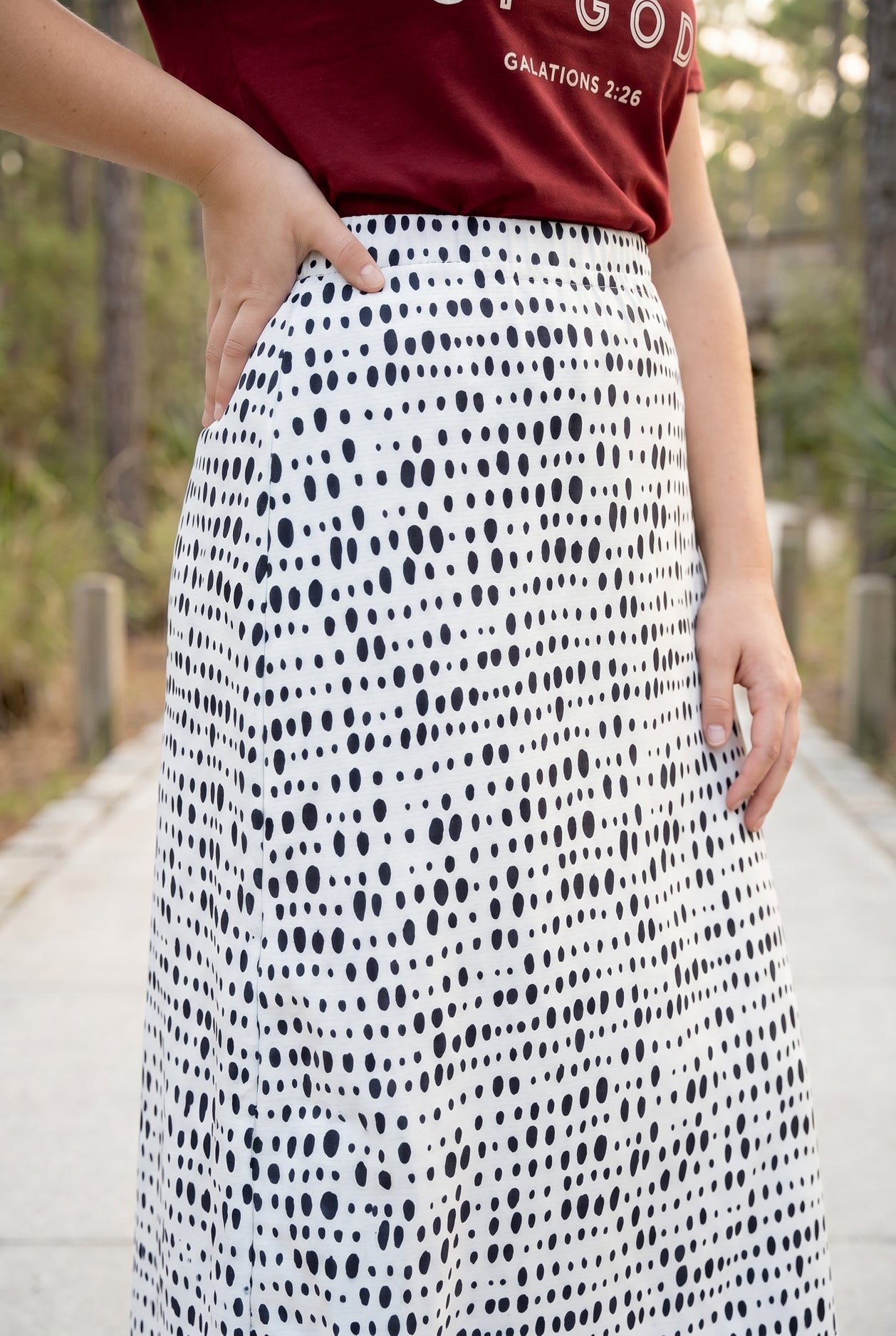 Model wearing Nuggles® 31" All-Sport Skirt in Dash Print