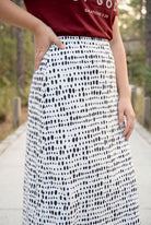 Model wearing Nuggles® 31" All-Sport Skirt in Dash Print