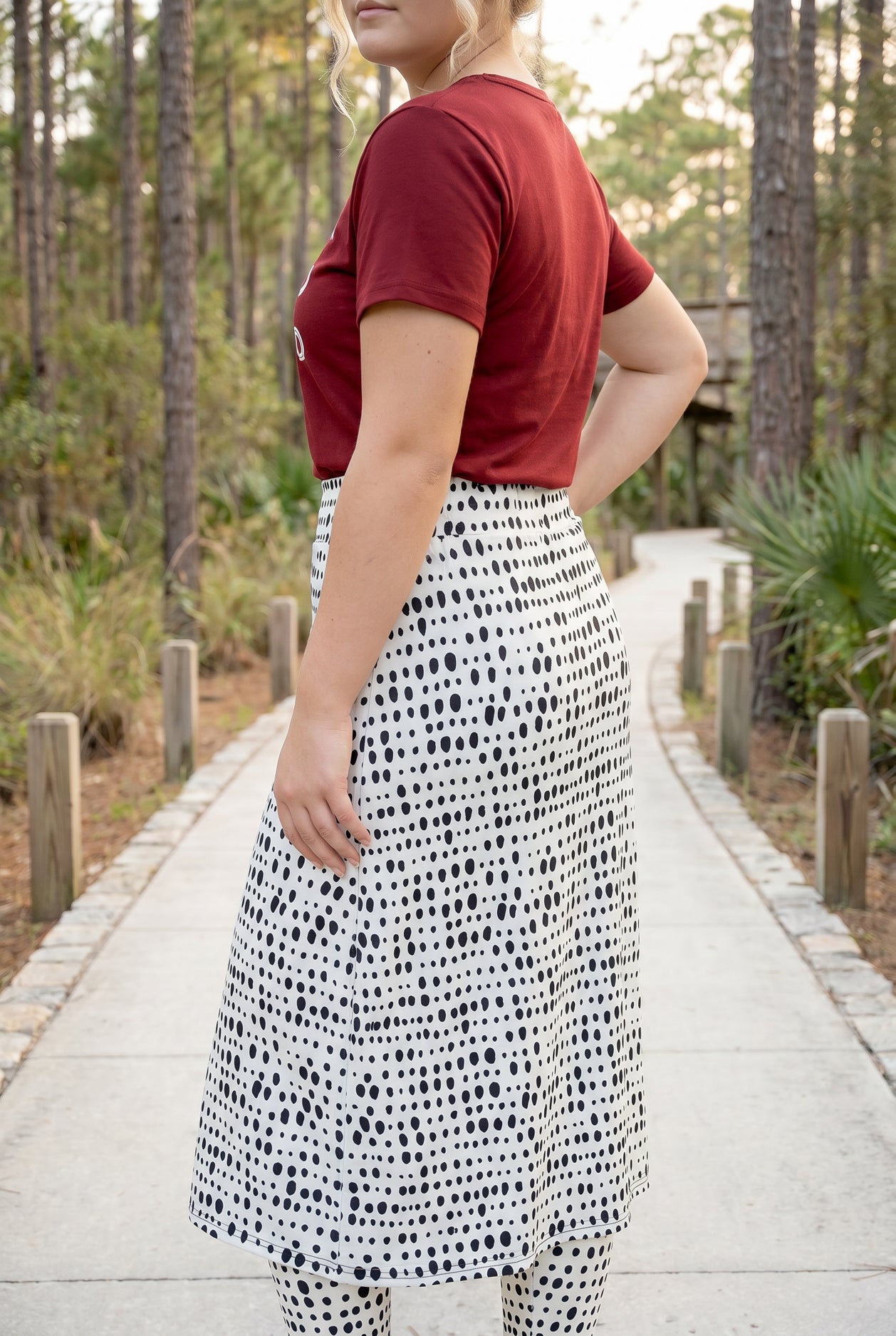 Model wearing Nuggles® 31" All-Sport Skirt in Dash Print