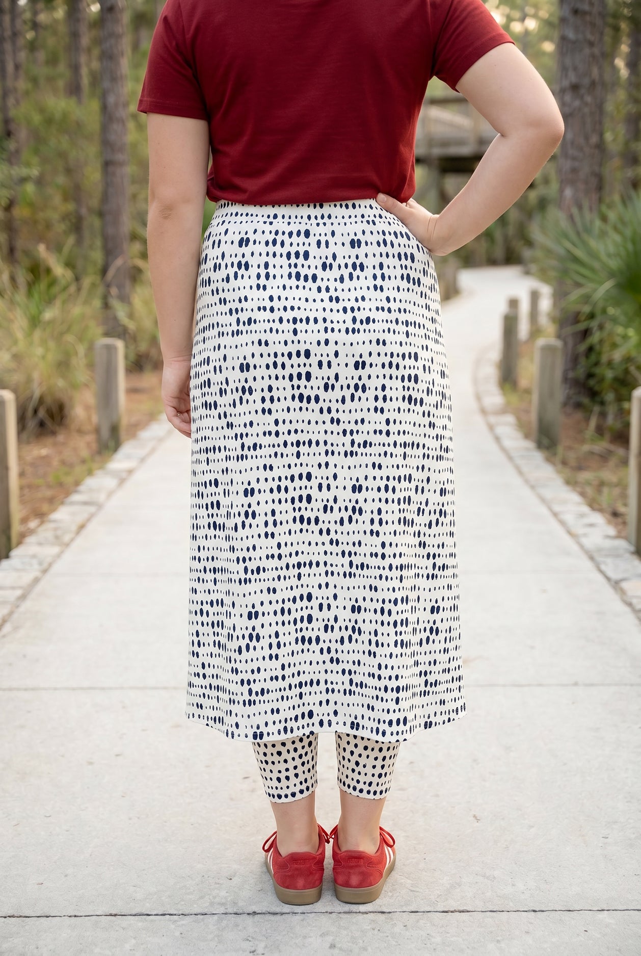 Model wearing Nuggles® 31" All-Sport Skirt in Dash Print