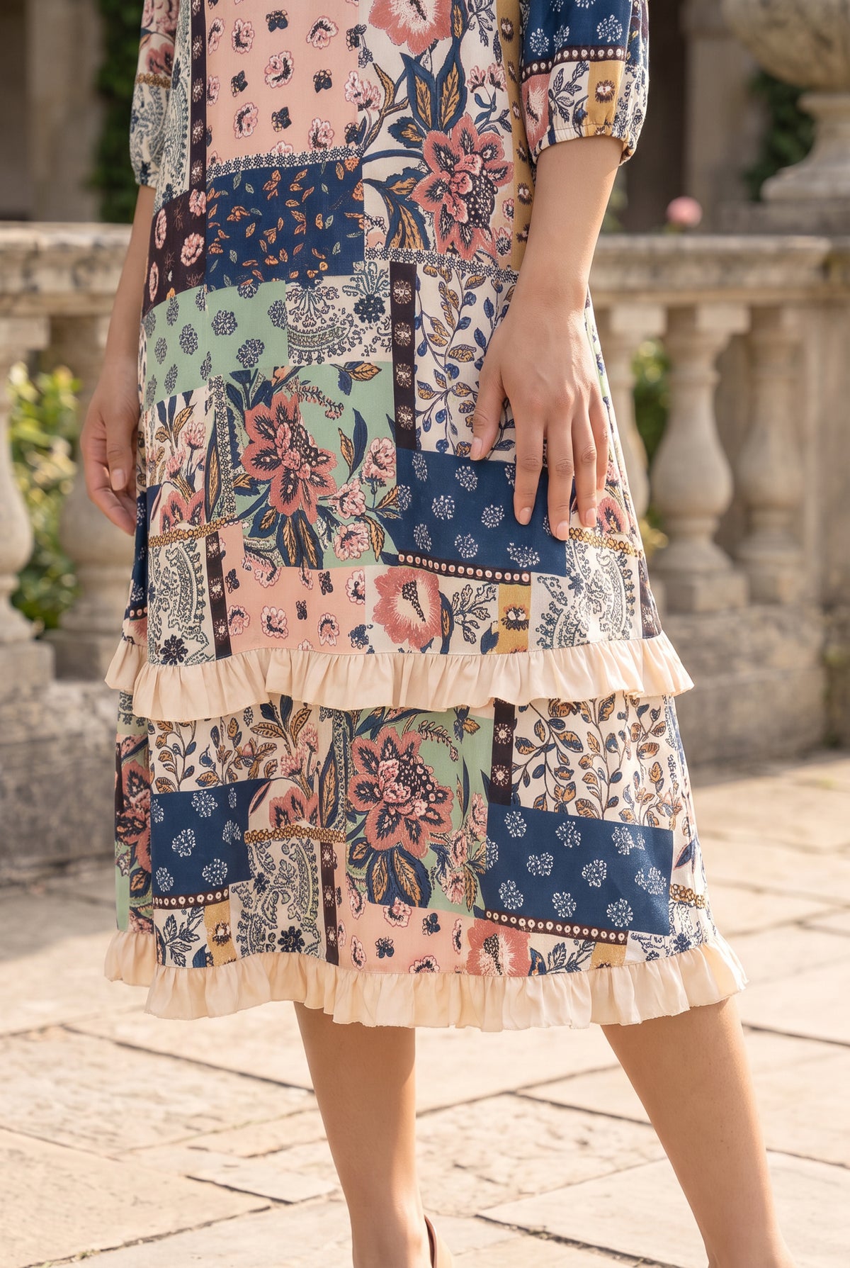 Nuggles® Patricia Dress in English Garden, close crop on the skirt showing both cream ruffle tiers and the hem