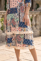 Nuggles® Patricia Dress in English Garden, close crop on the skirt showing both cream ruffle tiers and the hem