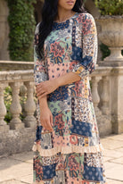 Nuggles® Patricia Dress in English Garden, three-quarter crop from neckline to hem with arms folded
