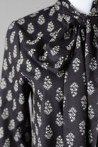 Nuggles® Felicity Bow Top in Quiet Black elegant womens blouse with feminine bow detail