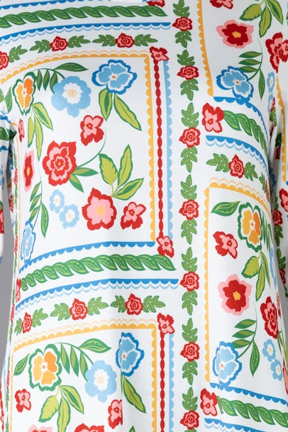 Model wearing Nuggles® Gracie Dress in Garden Stripe